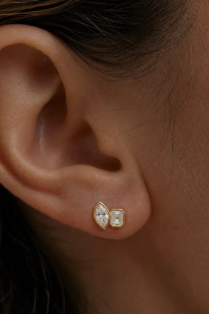 Marguerite Stud Earrings by Avant Studio – 18k gold plated sterling silver earrings with marquise and emerald-cut bezel-set stones.