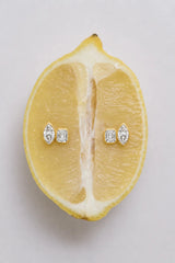 Marguerite Stud Earrings by Avant Studio – 18k gold plated sterling silver earrings with marquise and emerald-cut bezel-set stones.