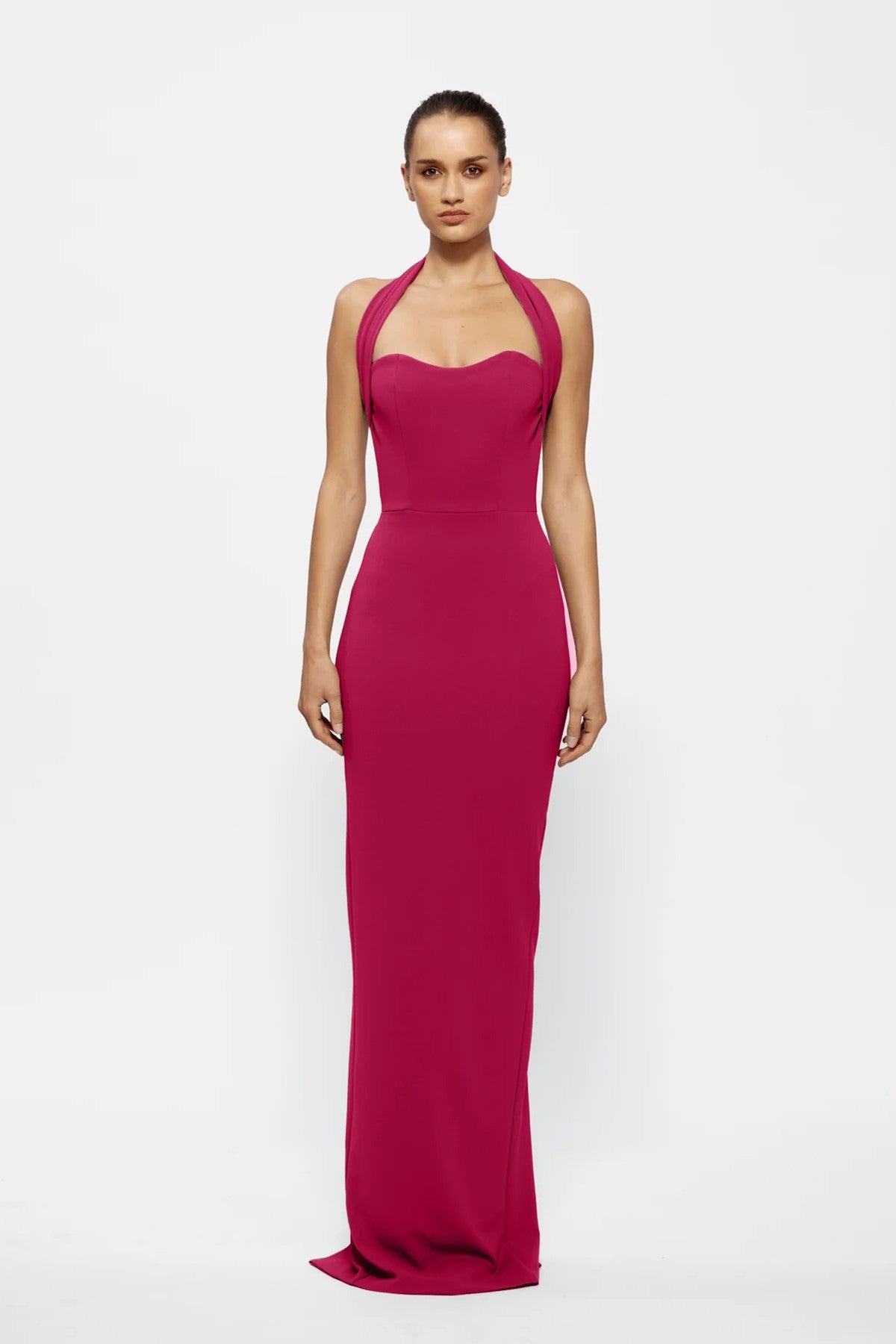 Marian Gown in Raspberry by Effie Kats, a halter-style stretch crepe gown featuring a sweetheart neckline, sculpted waist, and elegant midi hemline.