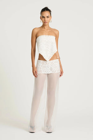 Marley Crochet Pant Cream by Benni, a sheer wide-leg pant with wrap lace mini skirt for a bold, elevated summer look.
