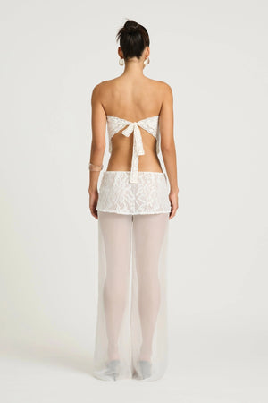 Marley Crochet Pant Cream by Benni, a sheer wide-leg pant with wrap lace mini skirt for a bold, elevated summer look.
