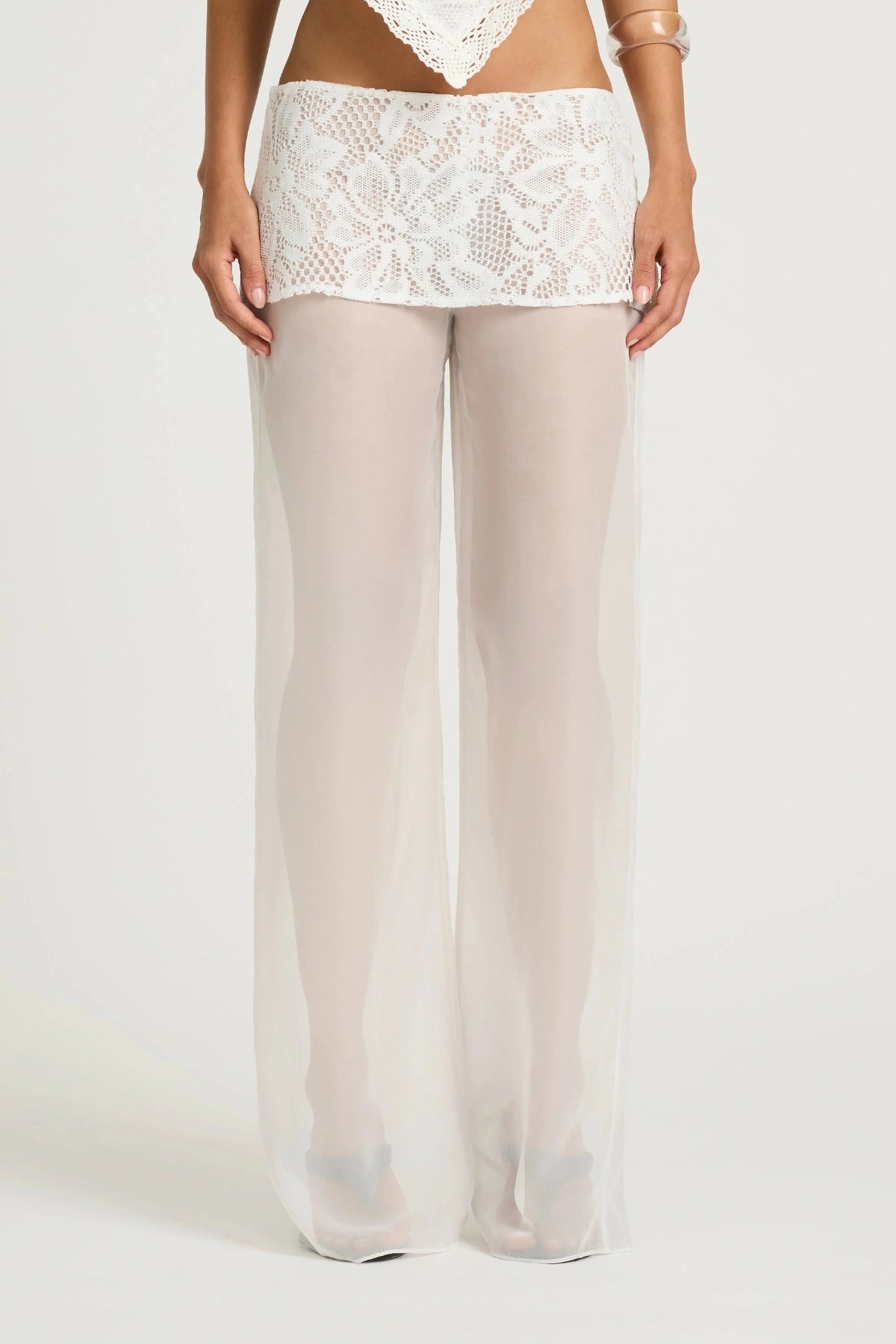 Marley Crochet Pant Cream by Benni, a sheer wide-leg pant with wrap lace mini skirt for a bold, elevated summer look.
