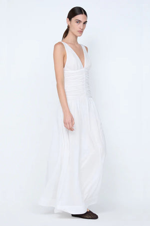 Marlowe Maxi Dress by Bec + Bridge, a white cotton voile maxi with V neckline, dropped waist, and gathered skirt—perfect for bridal or daytime elegance.