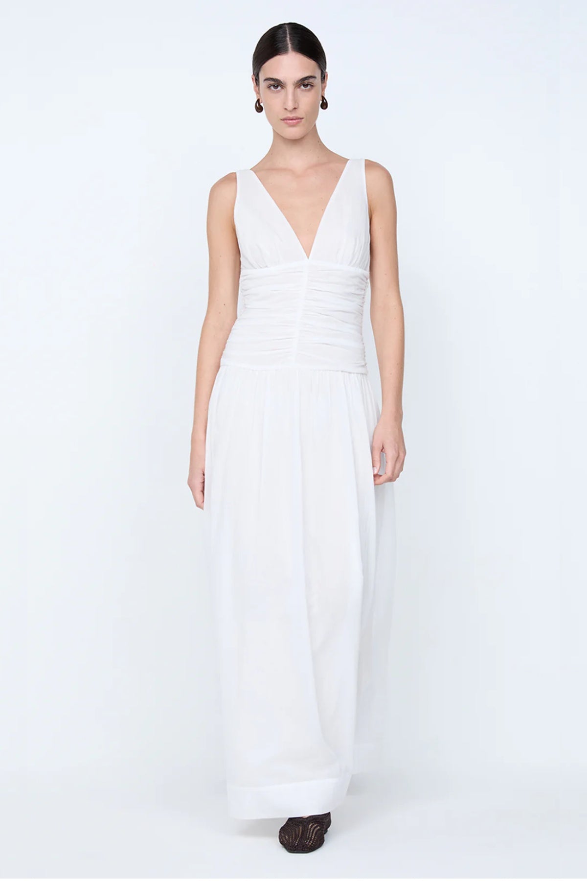 Marlowe Maxi Dress by Bec + Bridge, a white cotton voile maxi with V neckline, dropped waist, and gathered skirt—perfect for bridal or daytime elegance.