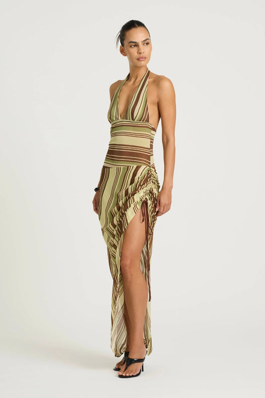 Marnie Maxi Dress Earth Stripe by Benni, a plunge halter maxi with draped skirt and adjustable side ruching for a flattering fit.
