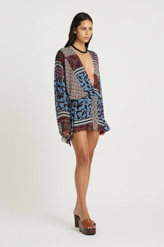 Marnie Shirt Dress by Benni, a breezy resort mini with adjustable waist and deep V neckline. Perfect for summer escapes or sunny weekends.