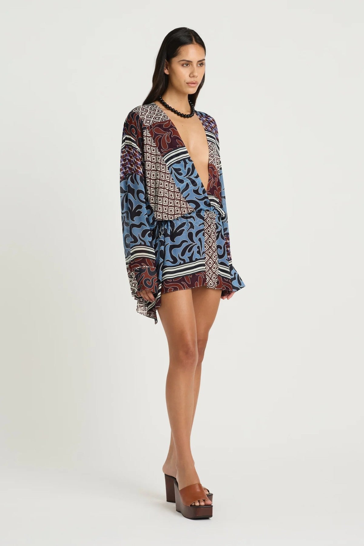 Marnie Shirt Dress by Benni, a breezy resort mini with adjustable waist and deep V neckline. Perfect for summer escapes or sunny weekends.