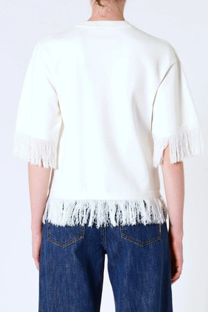 Marrakech Fringe Knit in White by Neuw Denim, a sleeveless relaxed knit with fringe hem. Perfect for layering with denim or linen.
