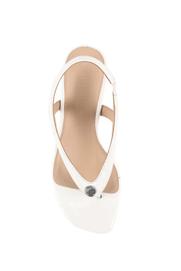 Martine Wedge by Lana Wilkinson — a white leather T-bar wedge with a sculpted 9.5cm heel, perfect for clean and elegant summer styling.