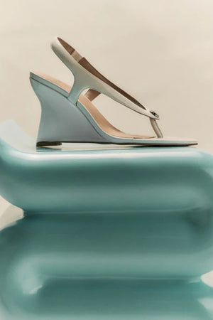 Martine Wedge by Lana Wilkinson — a white leather T-bar wedge with a sculpted 9.5cm heel, perfect for clean and elegant summer styling.