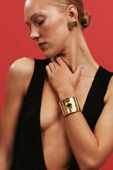 Matilde Cuff by Heaven Mayhem – a gold architectural cuff with deep burgundy enamel, perfect for bold refined styling.