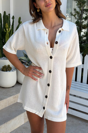 Melissa Knit Mini Dress Ivory by Sneaky Link – a collared button-down knit mini with soft drape. Perfect for easy summer styling.