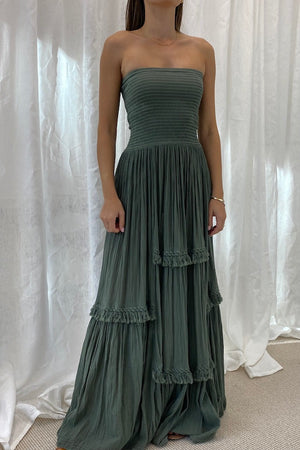 Melita Dress Khaki by D' Artemide – a strapless dress with ruched bodice and tiered skirt. Perfect for beachside styling.