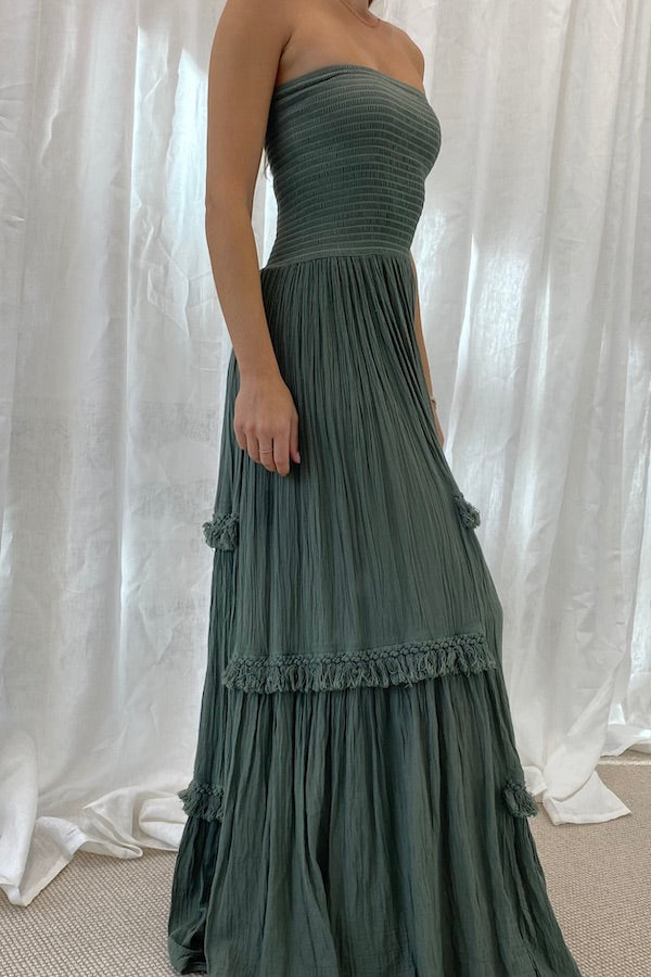 Melita Dress Khaki by D' Artemide – a strapless dress with ruched bodice and tiered skirt. Perfect for beachside styling.