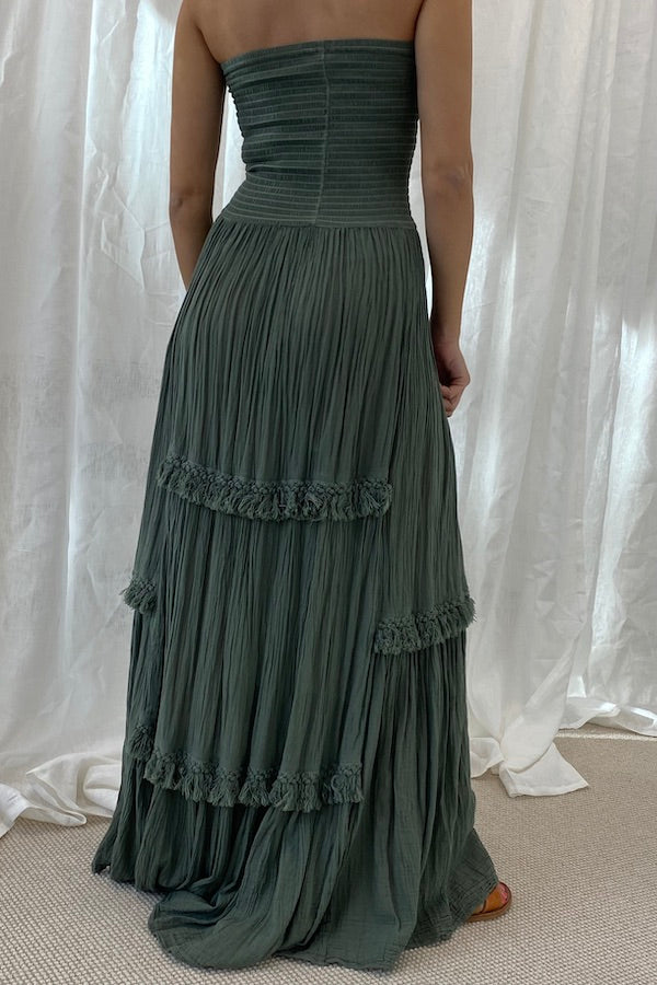 Melita Dress Khaki by D' Artemide – a strapless dress with ruched bodice and tiered skirt. Perfect for beachside styling.