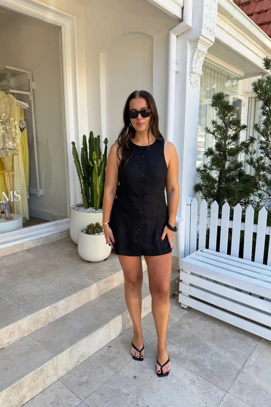 Mia Mini Dress Black by Sneaky Link – a linen mini with button front and easy fit. Perfect for effortless summer styling.