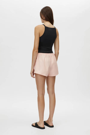 Milo Short by Camilla and Marc – pink mid-rise pull-on shorts with an elastic waistband and side splits, perfect for easy polished styling.
