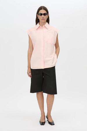 Milo Sleeveless Shirt by Camilla and Marc – a pink sleeveless shirt with clean tailoring and a curved hem, perfect for soft polished styling.