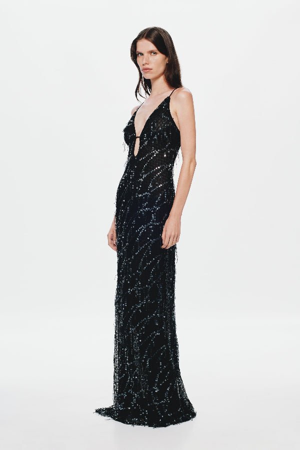 Onyx Sequin Dress by Misha, a sheer black gown with sequins, plunging neckline, and open back. Perfect for glamorous evenings.