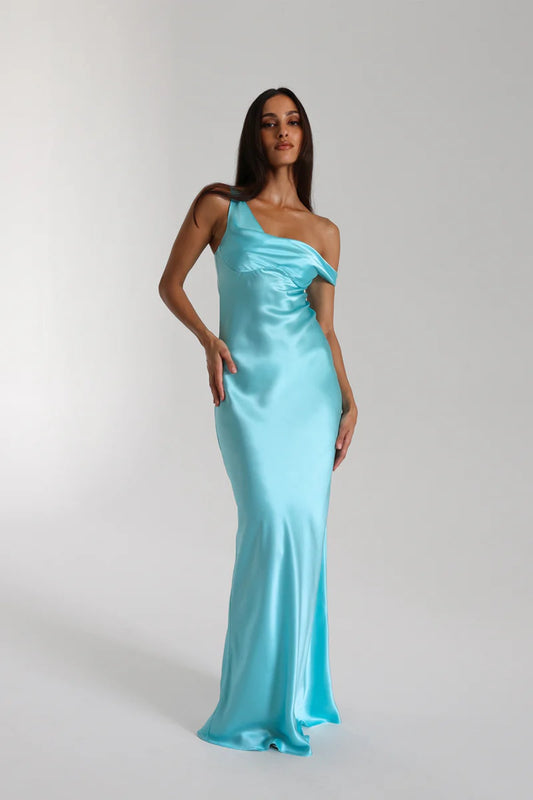 Monika Gown Turquoise by Natalie Rolt, a bias-cut silk gown with asymmetrical drape and refined fit for elegant occasions.