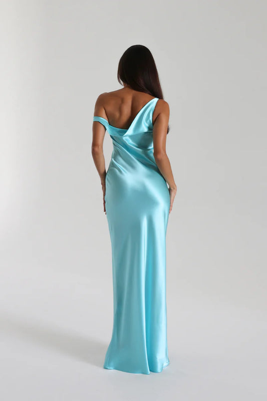 Monika Gown Turquoise by Natalie Rolt, a bias-cut silk gown with asymmetrical drape and refined fit for elegant occasions.