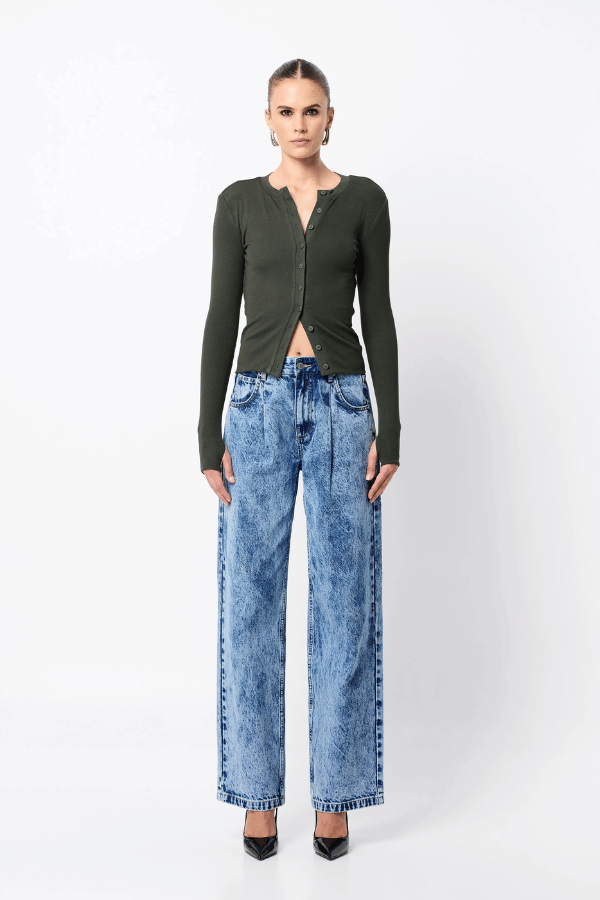 Lyon Cardigan by Mossman, a fitted ribbed knit in moss green with thumb hole sleeves and button front. Perfect for layering year-round.