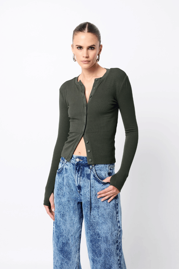 Lyon Cardigan by Mossman, a fitted ribbed knit in moss green with thumb hole sleeves and button front. Perfect for layering year-round.
