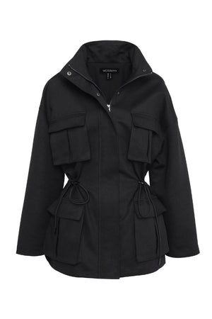 Mossman My Muse Anorak in Black, a modern utility jacket featuring oversized flap pockets, adjustable drawstring waist, and a concealed zip front for an elevated off-duty look.