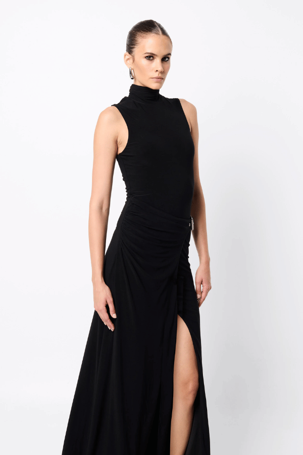 Rebellion Maxi Dress by Mossman, a black stretch jersey gown with high neckline, buckle wrap detail, and front split. Perfect for nights out.