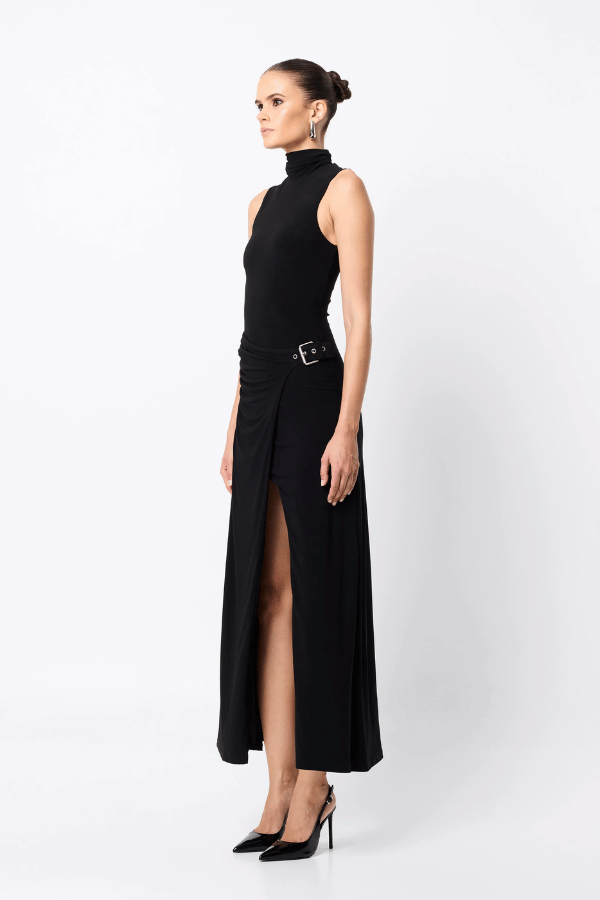Rebellion Maxi Dress by Mossman, a black stretch jersey gown with high neckline, buckle wrap detail, and front split. Perfect for nights out.