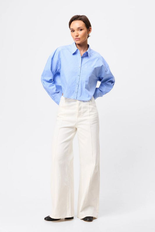 Mossman Repeat After Me Cropped Shirt in Blue Stripe, a chic cropped button-up with crisp white stripes, patch pockets, and extended cuffs for elevated everyday style.
