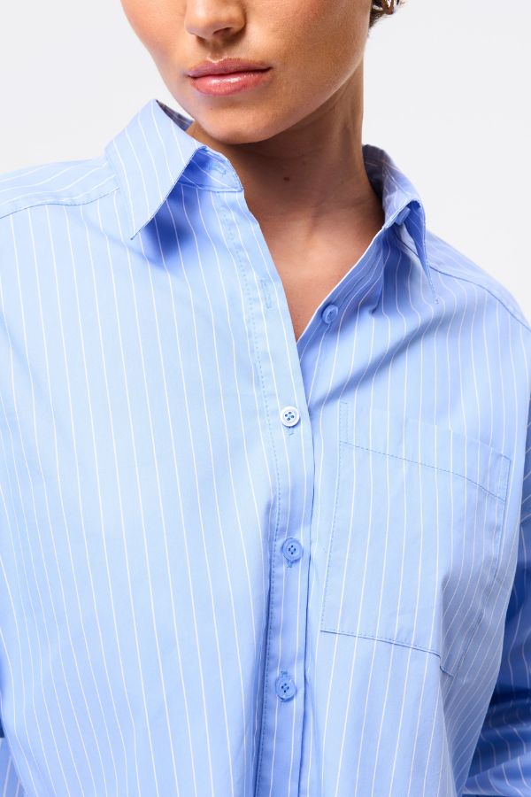 Mossman Repeat After Me Cropped Shirt in Blue Stripe, a chic cropped button-up with crisp white stripes, patch pockets, and extended cuffs for elevated everyday style.