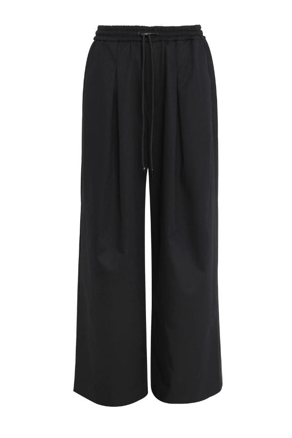Mossman Tied Down Pant in Black, a wide-leg cotton pant featuring an elasticated waistband with adjustable toggle and functional pockets for chic utility style.