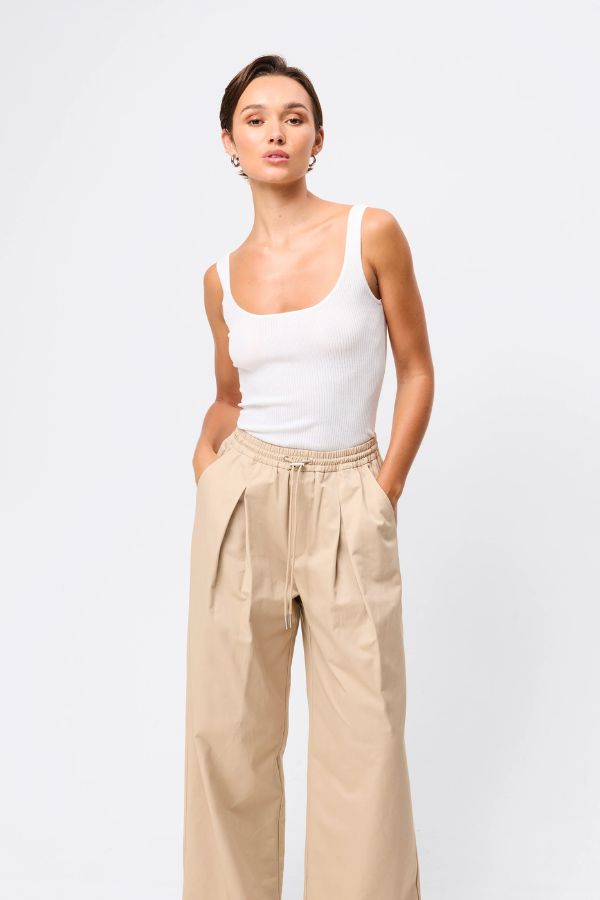 Mossman Tied Down Pant in Natural, a relaxed wide-leg cotton pant featuring an elasticated waistband with adjustable toggle and functional pockets for versatile everyday style. 3 