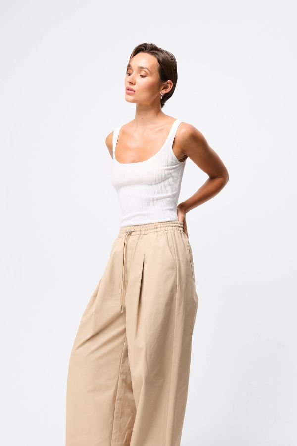 Mossman Tied Down Pant in Natural, a relaxed wide-leg cotton pant featuring an elasticated waistband with adjustable toggle and functional pockets for versatile everyday style. 4 