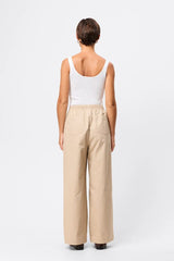 Mossman Tied Down Pant in Natural, a relaxed wide-leg cotton pant featuring an elasticated waistband with adjustable toggle and functional pockets for versatile everyday style. 6 