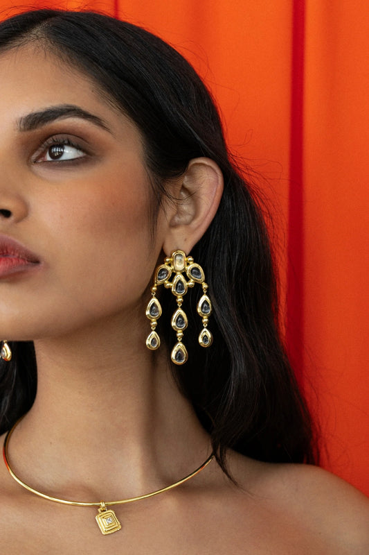 Mountain and Moon Rani Earrings in gold with chandelier silhouette, crystal quartz gemstones, and hammered polished finish.