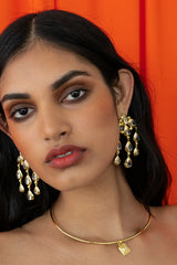 Mountain and Moon Rani Earrings in gold with chandelier silhouette, crystal quartz gemstones, and hammered polished finish.