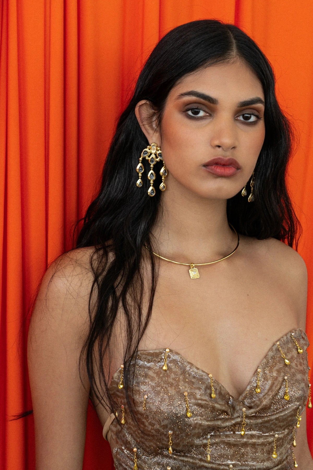 Mountain and Moon Rani Earrings in gold with chandelier silhouette, crystal quartz gemstones, and hammered polished finish.