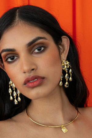 Mountain and Moon Rani Earrings in gold with chandelier silhouette, crystal quartz gemstones, and hammered polished finish.