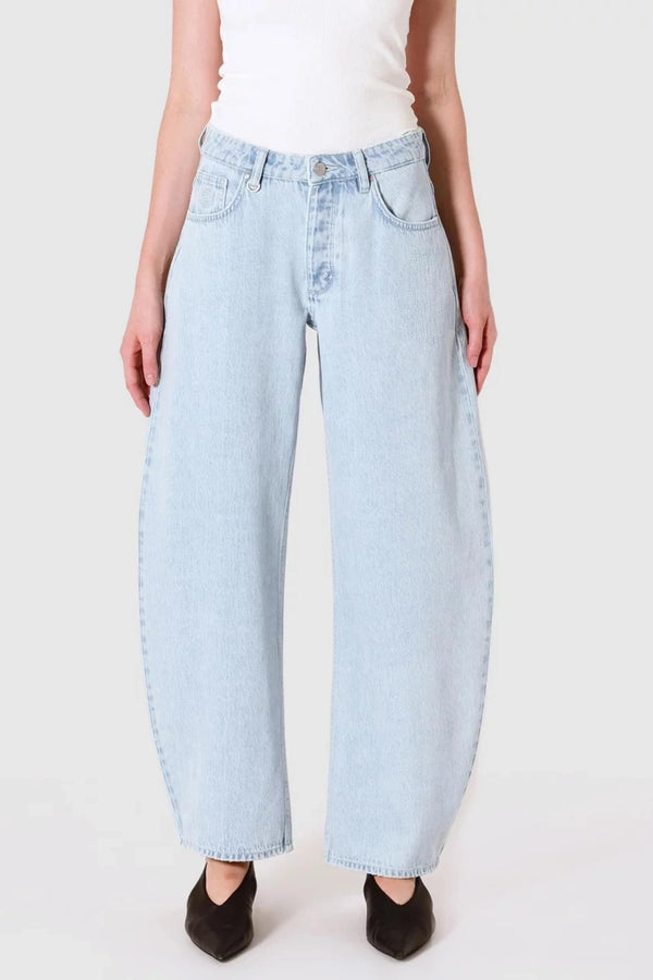 Nancy Barrel Adieu Jeans by Neuw Denim, mid-rise barrel leg denim in light vintage indigo. Perfect for laid-back, timeless outfits.