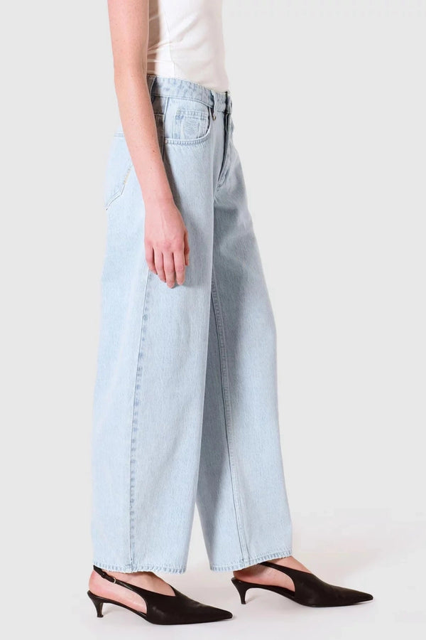 Nancy Barrel Adieu Jeans by Neuw Denim, mid-rise barrel leg denim in light vintage indigo. Perfect for laid-back, timeless outfits.