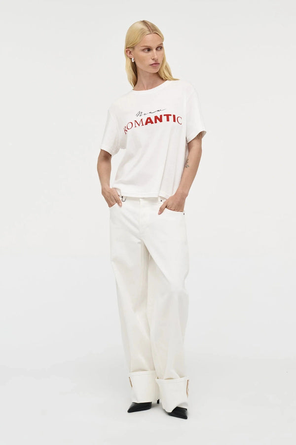 Nancy Barrel – White by Neuw Denim, mid-rise barrel leg jeans with cuffed hem and stretch comfort. Perfect for modern denim styling.