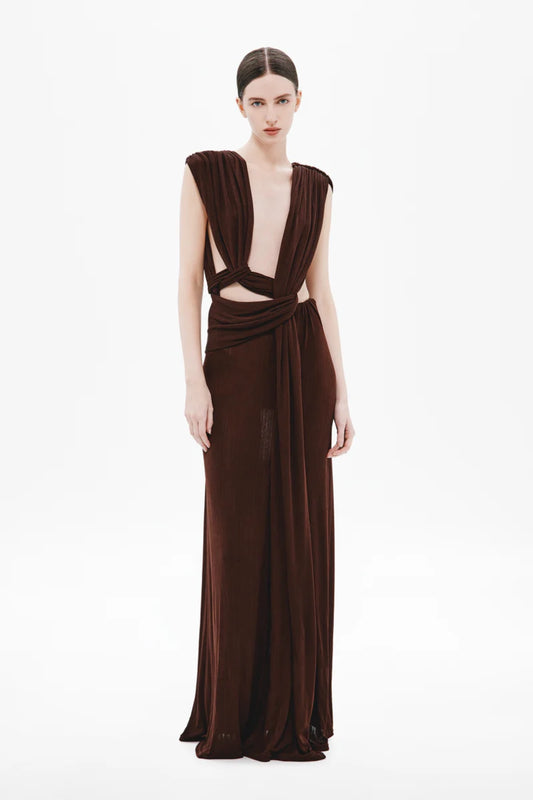 Naomi Draped Rib Dress by Misha, a ribbed plant-based acetate gown with plunging neckline, twisted waist, and side cutouts for modern elegance.