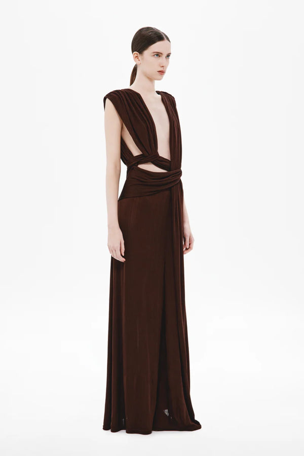 Naomi Draped Rib Dress by Misha, a ribbed plant-based acetate gown with plunging neckline, twisted waist, and side cutouts for modern elegance.