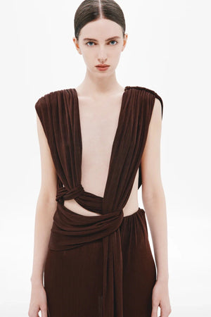 Naomi Draped Rib Dress by Misha, a ribbed plant-based acetate gown with plunging neckline, twisted waist, and side cutouts for modern elegance.