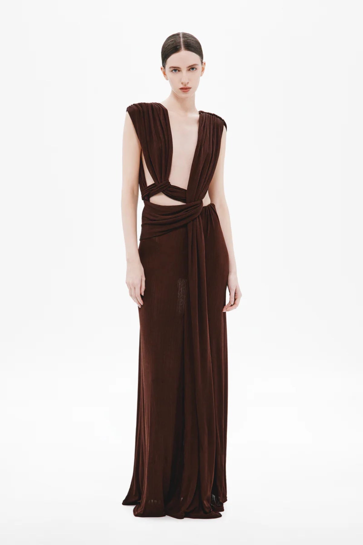Naomi Draped Rib Dress by Misha, a ribbed plant-based acetate gown with plunging neckline, twisted waist, and side cutouts for modern elegance.