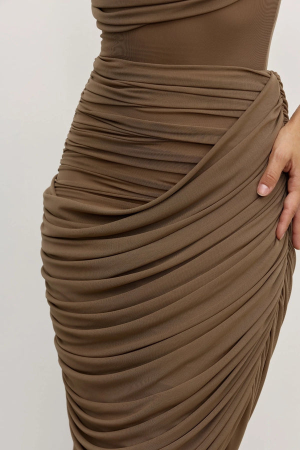 Nara Skirt Mink by Bayse – ruched mesh maxi skirt with draped overlay and body-contouring silhouette.