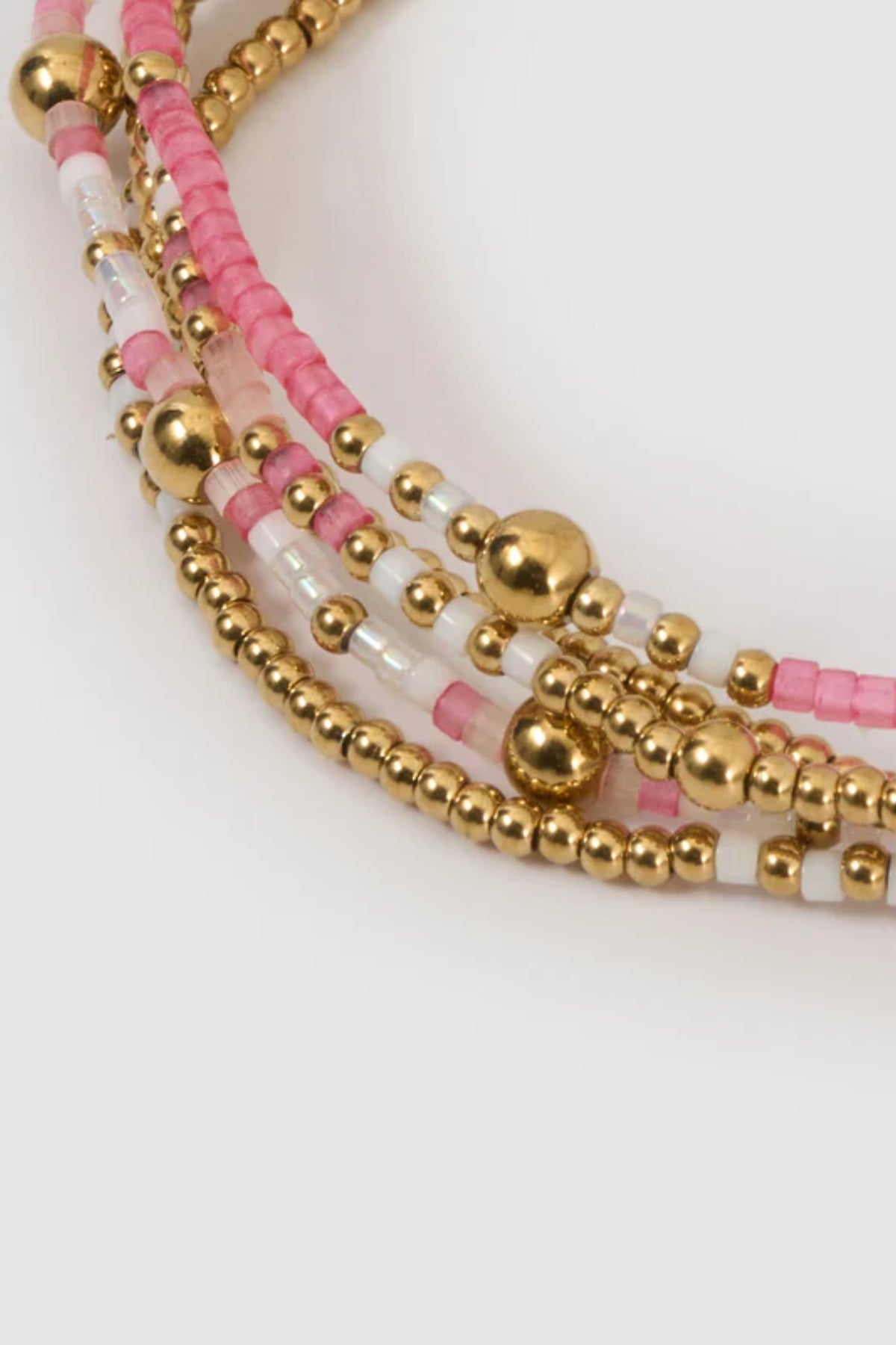 Nellie Bracelet Bubblegum by Arms of Eve, vibrant beaded bracelet featuring pink, white, and gold tones for a playful, stackable everyday look.