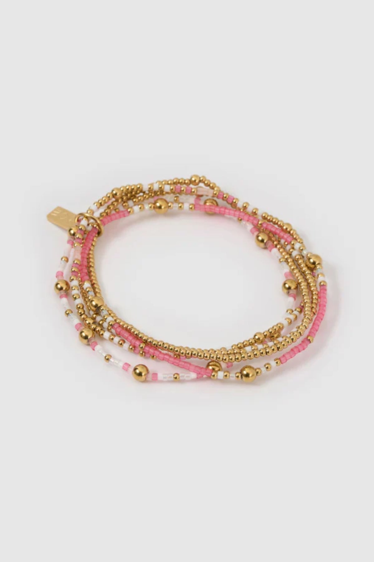 Nellie Bracelet Bubblegum by Arms of Eve, vibrant beaded bracelet featuring pink, white, and gold tones for a playful, stackable everyday look.